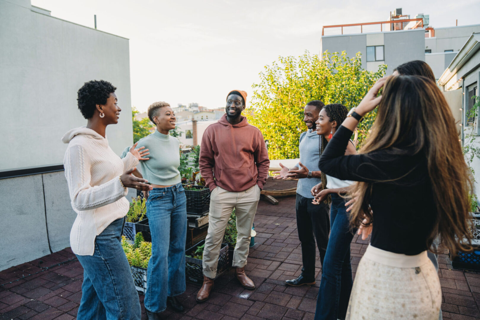 People socializing on a sunny rooftop